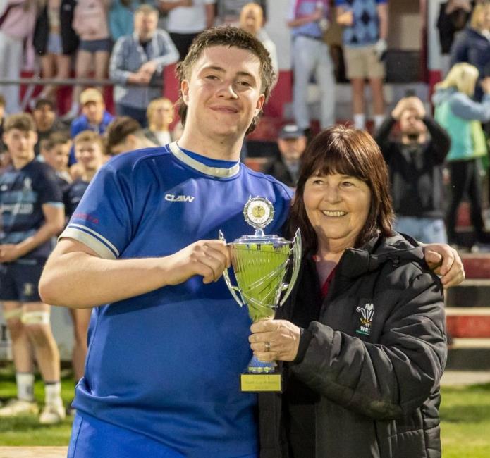 Harri Evans receives the Youth Cup for Haverfodwest from Delyth Summons of the WRU